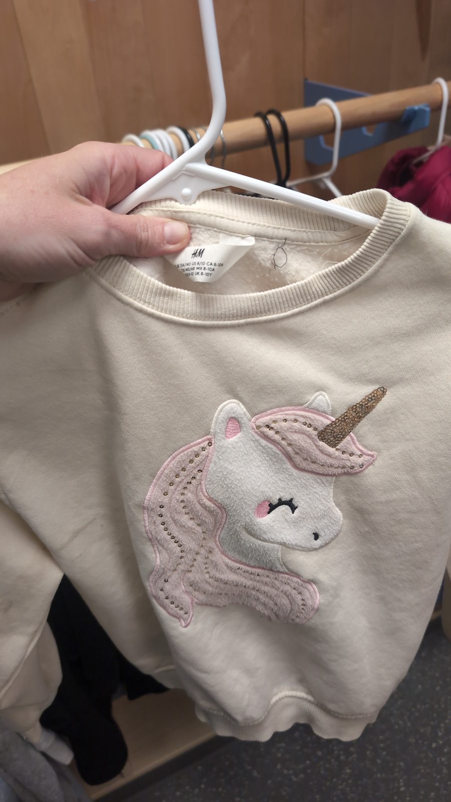 Cream colored sweatshirt, unicorn on the front, from H &M size 8-10