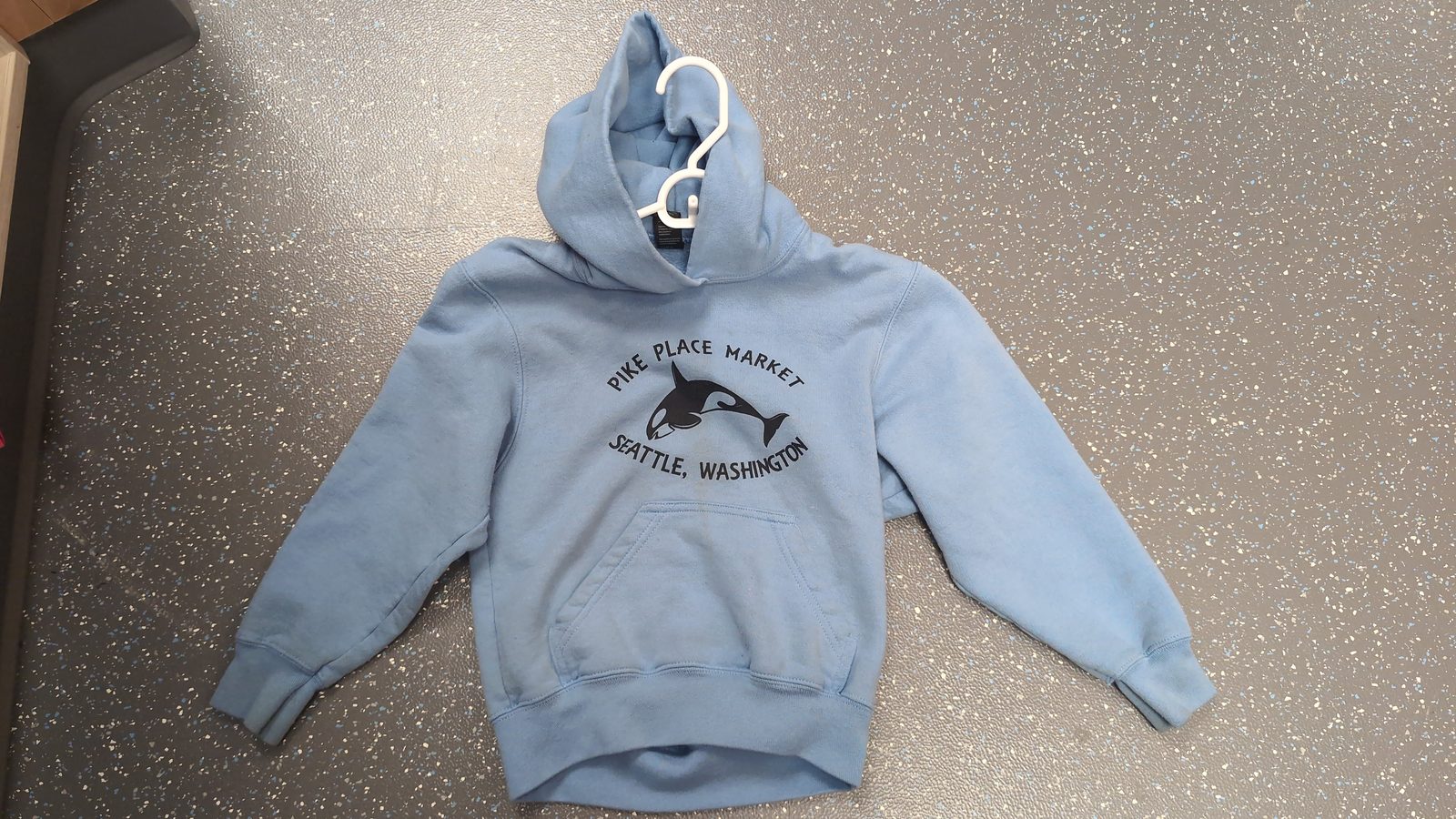 Light blue hoodie, child-sized.